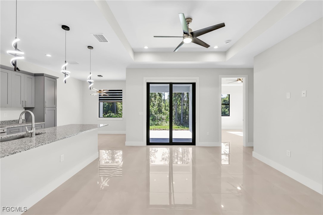 8771-8773 Buckingham Road Lehigh Acres, FL 33971 - Photo 31 of 34 a large white kitchen with a large window