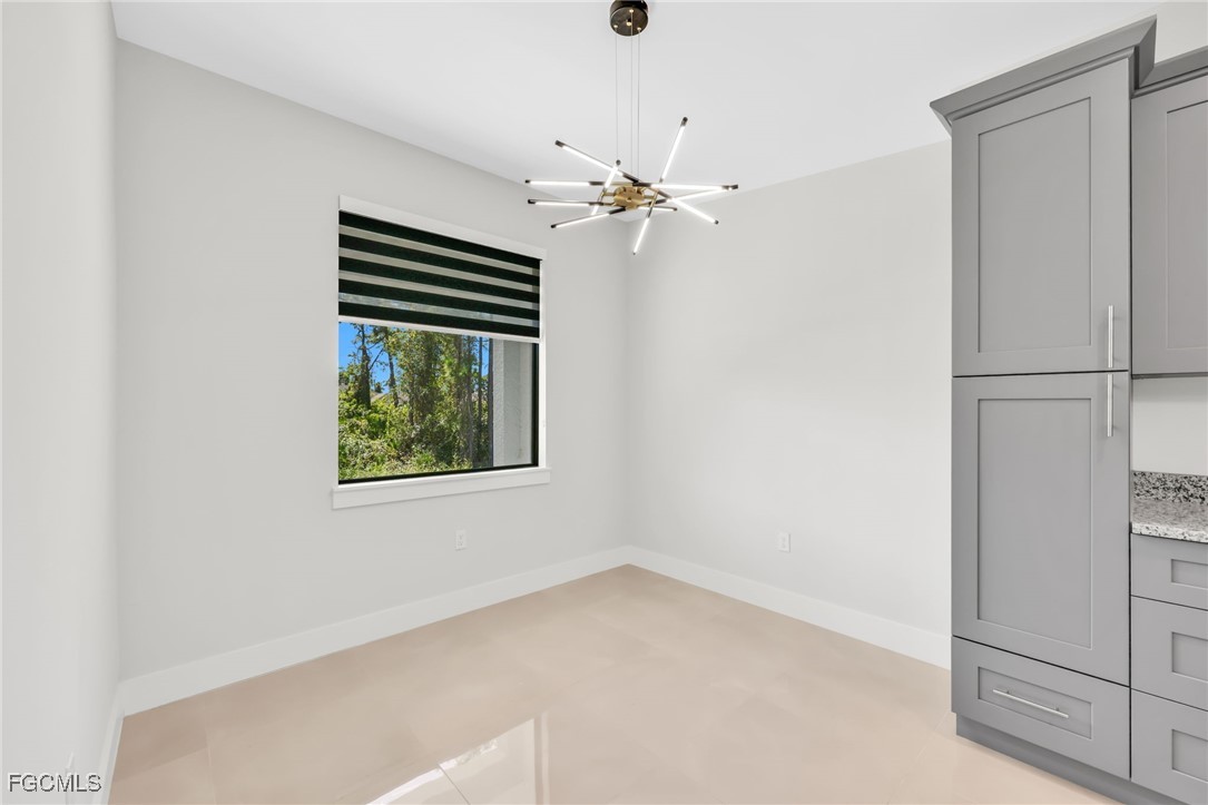 8771-8773 Buckingham Road Lehigh Acres, FL 33971 - Photo 7 of 34 a view of an empty room with a window