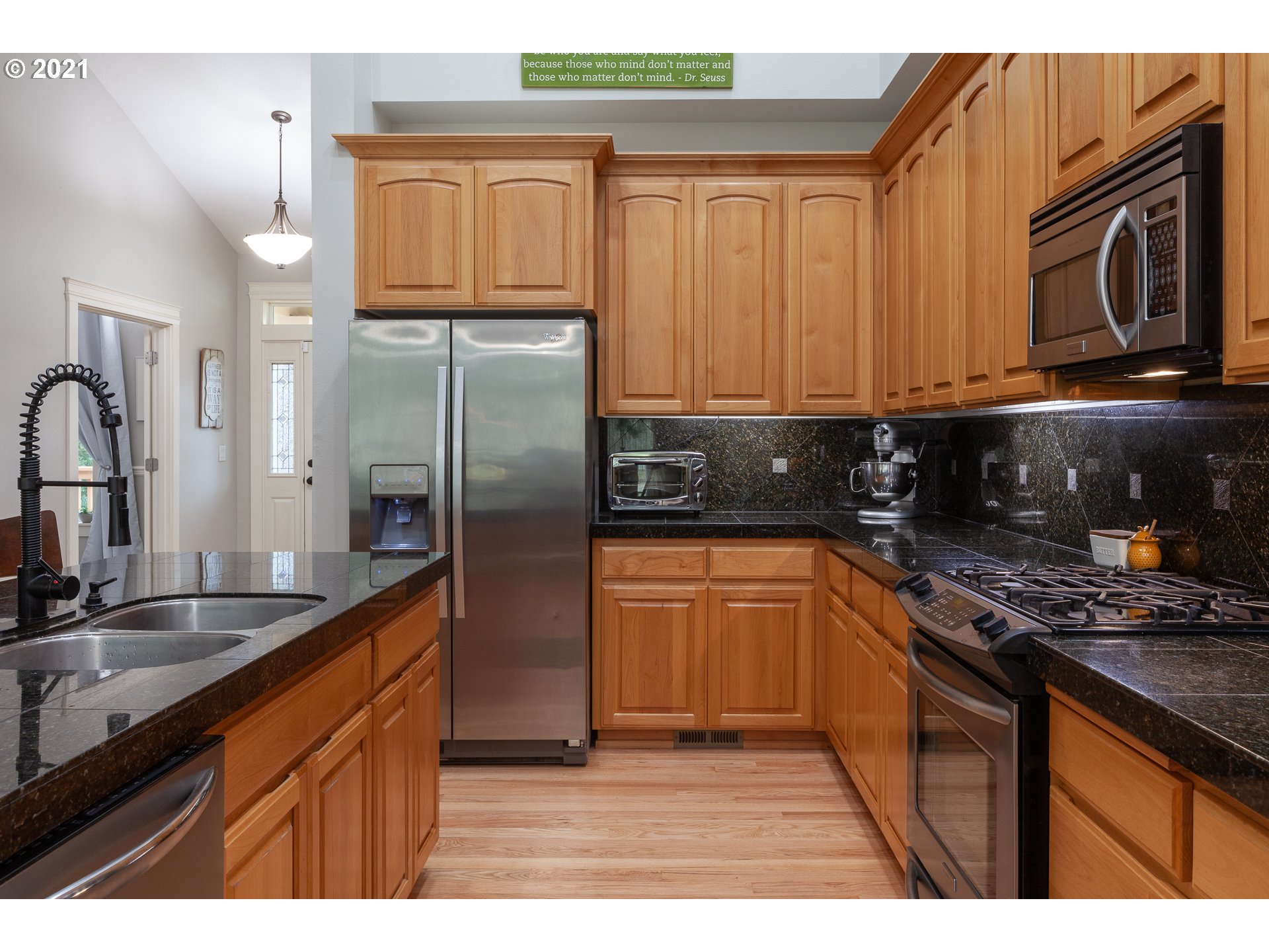 875 Northwest Angel Heights Road Stevenson, WA 98648 - Photo 13 of 32 a kitchen with stainless steel appliances granite countertop a stove a sink and a microwave