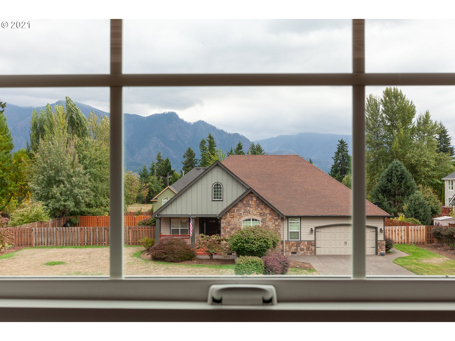 875 Northwest Angel Heights Road Stevenson, WA 98648 - Photo 26 of 32 a view of a house next to a yard