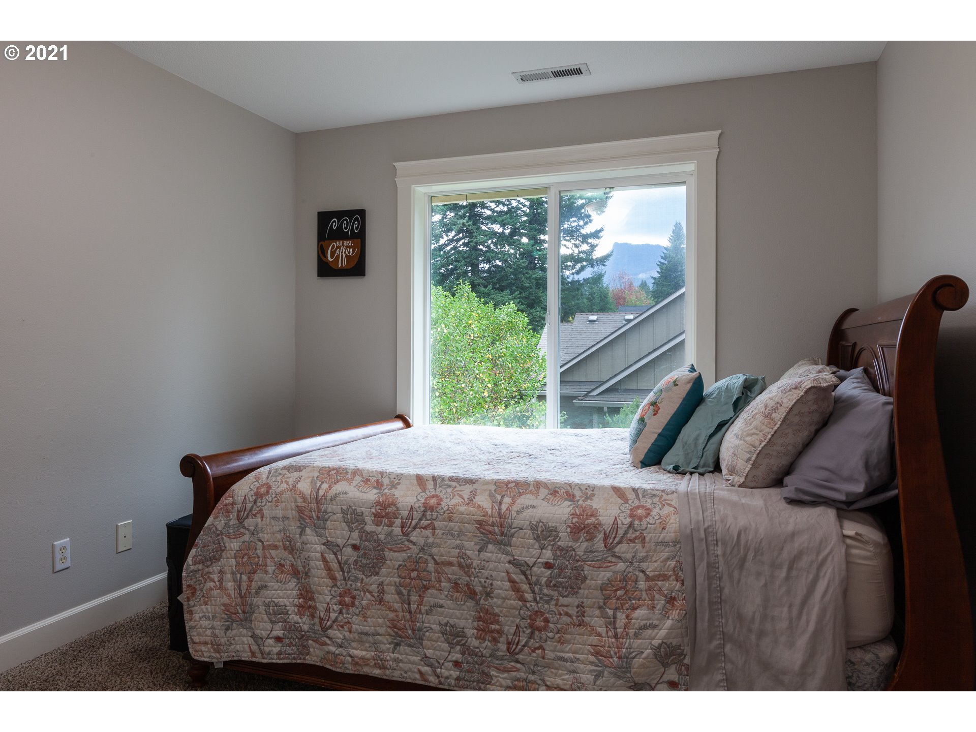 875 Northwest Angel Heights Road Stevenson, WA 98648 - Photo 28 of 32 a bedroom with a bed and a window