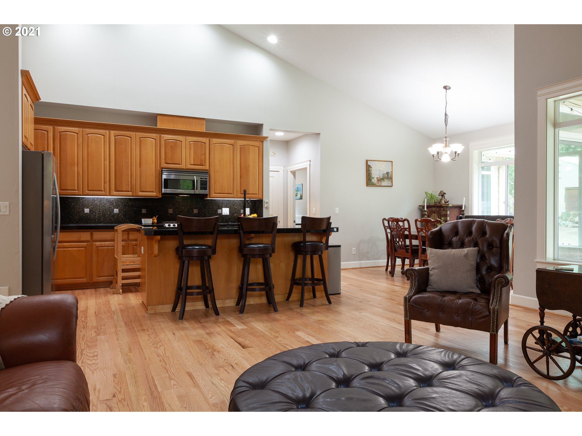 875 Northwest Angel Heights Road Stevenson, WA 98648 - Photo 10 of 32 a living room with furniture a piano and a fireplace