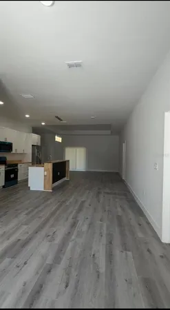 a view of kitchen and kitchen with furniture