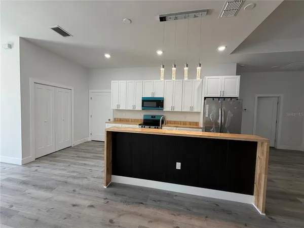 a view of kitchen with wooden floor