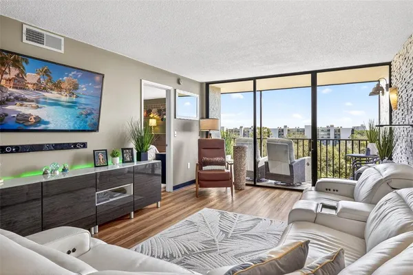 a bedroom with a bed and painting on the wall