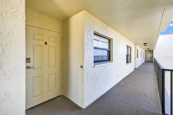 a kitchen with stainless steel appliances kitchen island granite countertop a refrigerator and a stove top oven