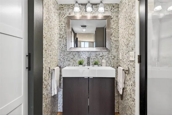 an aerial view of residential houses with outdoor space and swimming pool