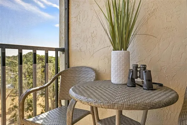 a kitchen with a refrigerator a stove top oven and a sink