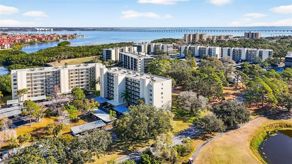 a view of a house with a swimming pool and a yard