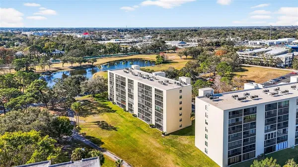 a view of a swimming pool with a garden and swimming pool