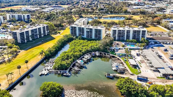 a view of a swimming pool with a table and chairs