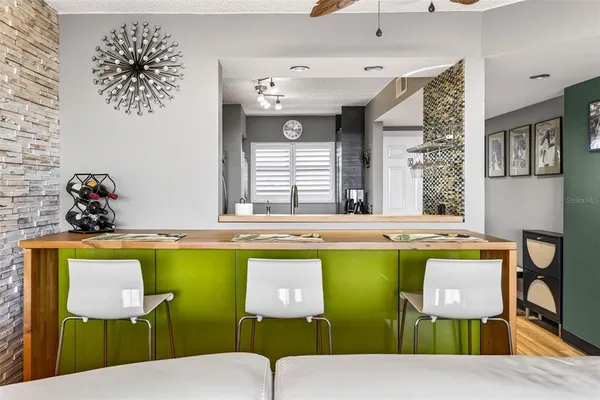 a open kitchen with granite countertop a sink and a stove