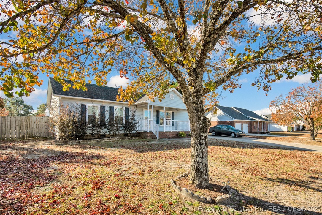 101 2 Hours Court Raeford, NC 28376 - Photo 2 of 30 a large tree in front of a brick house