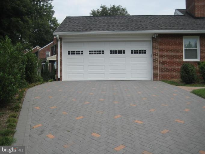 9607 Flower Avenue Silver Spring, MD 20901 - Photo 23 of 24 Two car garage with door to office/den inside