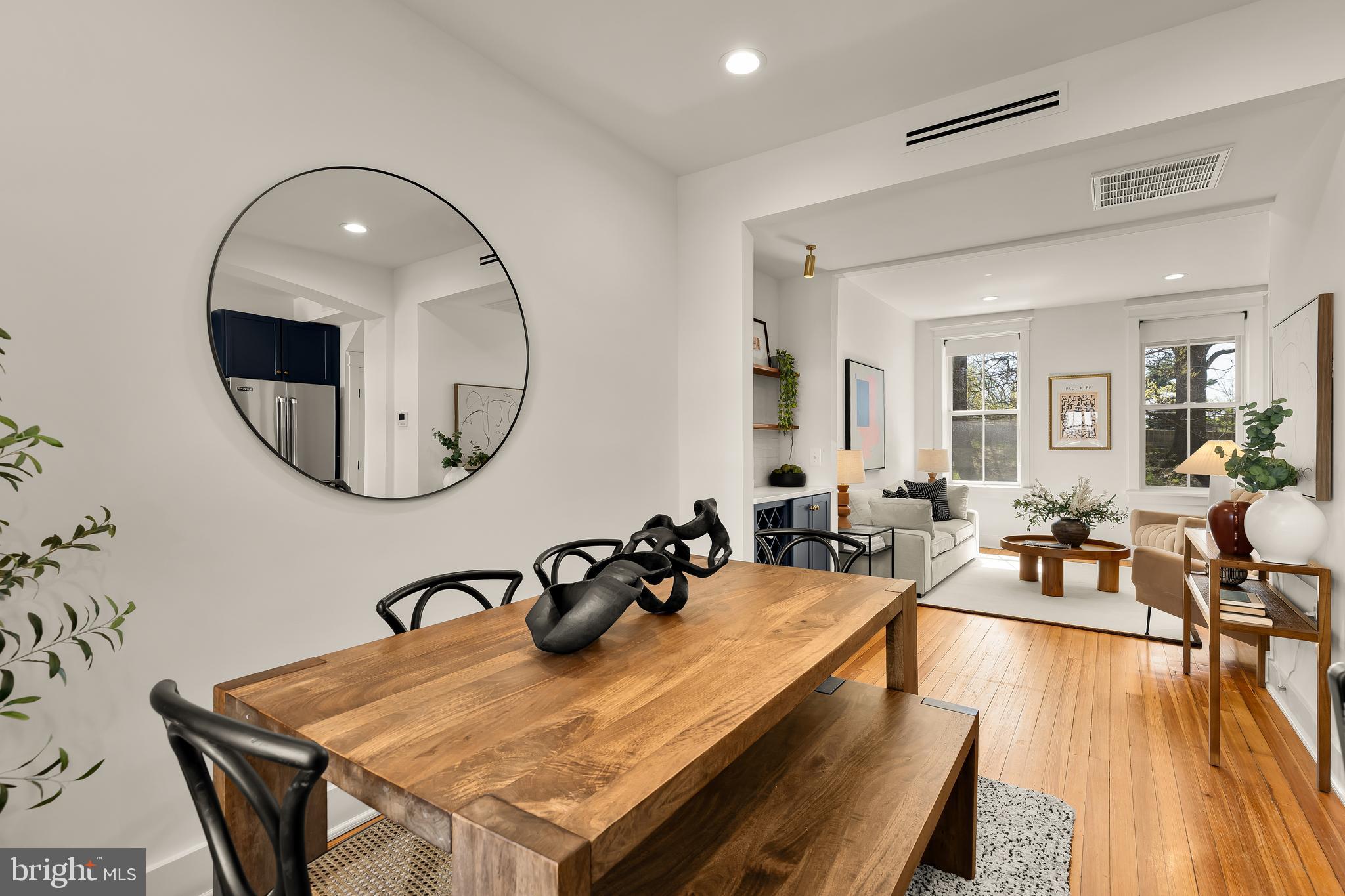 409 Columbia Road Northwest Washington, DC 20001 - Photo 11 of 41 a view of a dining room with furniture and a mirror