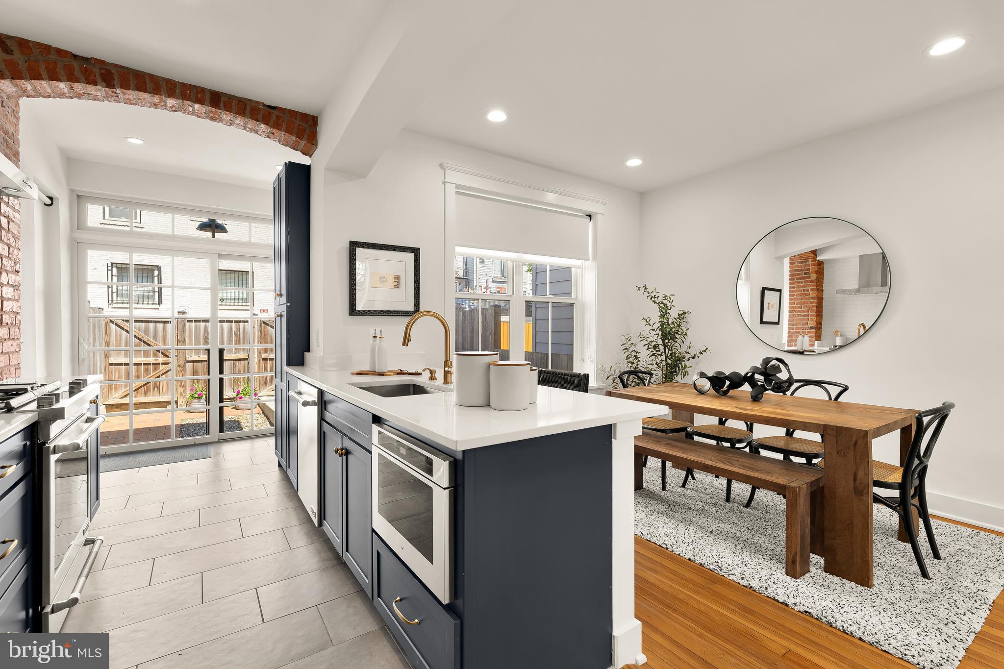 409 Columbia Road Northwest Washington, DC 20001 - Photo 15 of 41 a large kitchen with a table and chairs