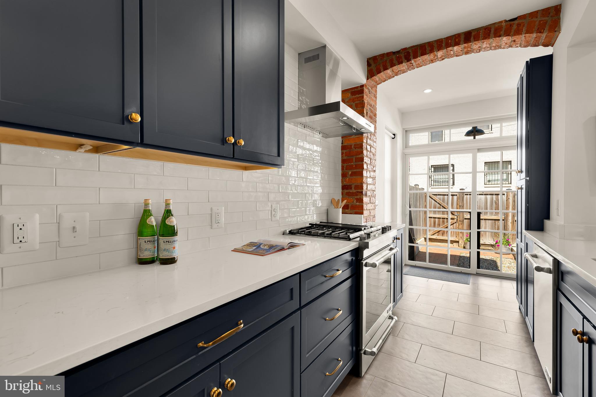 409 Columbia Road Northwest Washington, DC 20001 - Photo 18 of 41 a kitchen with a sink and cabinets