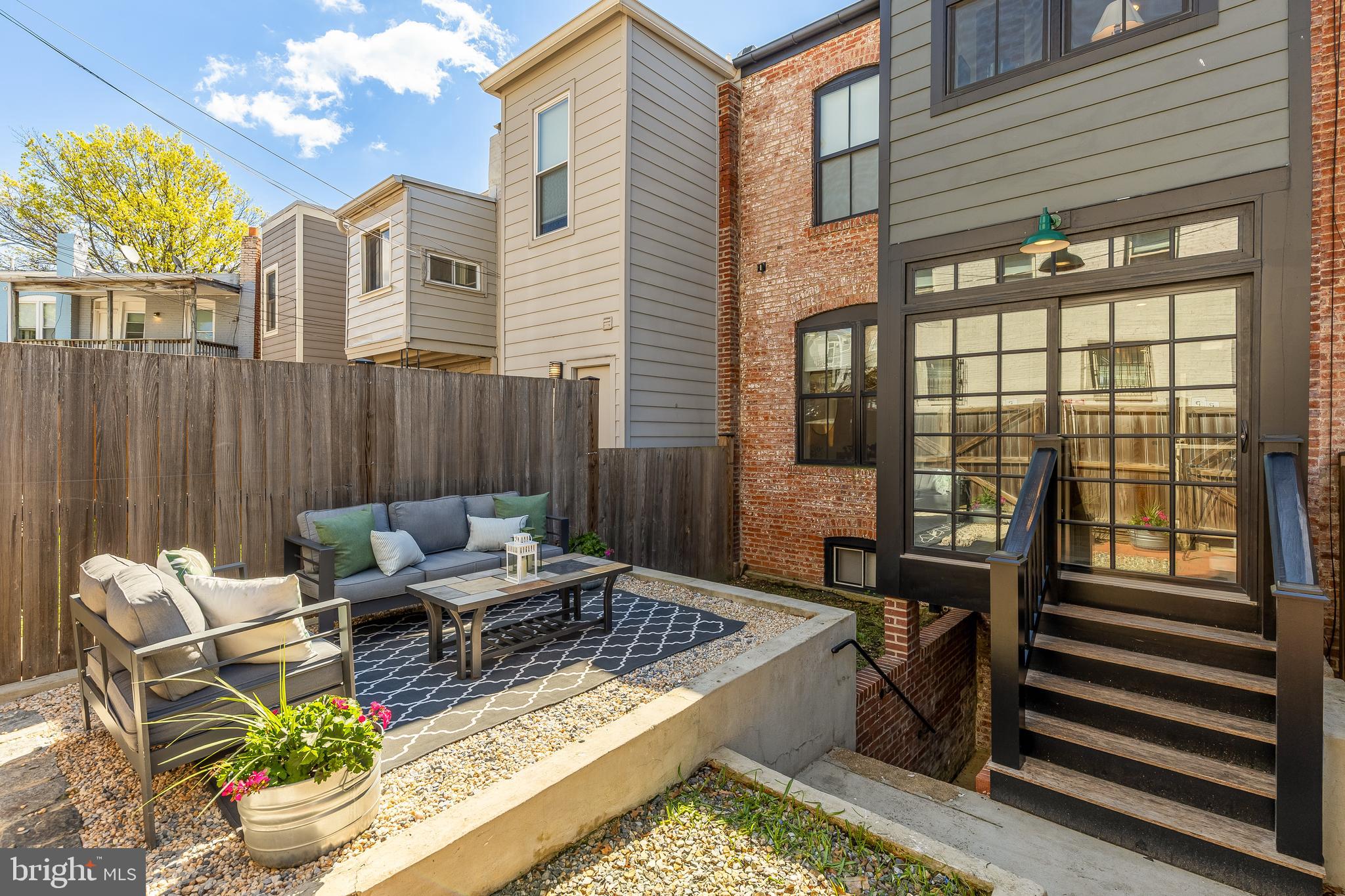 409 Columbia Road Northwest Washington, DC 20001 - Photo 20 of 41 a view of a patio with couches chairs and wooden floor