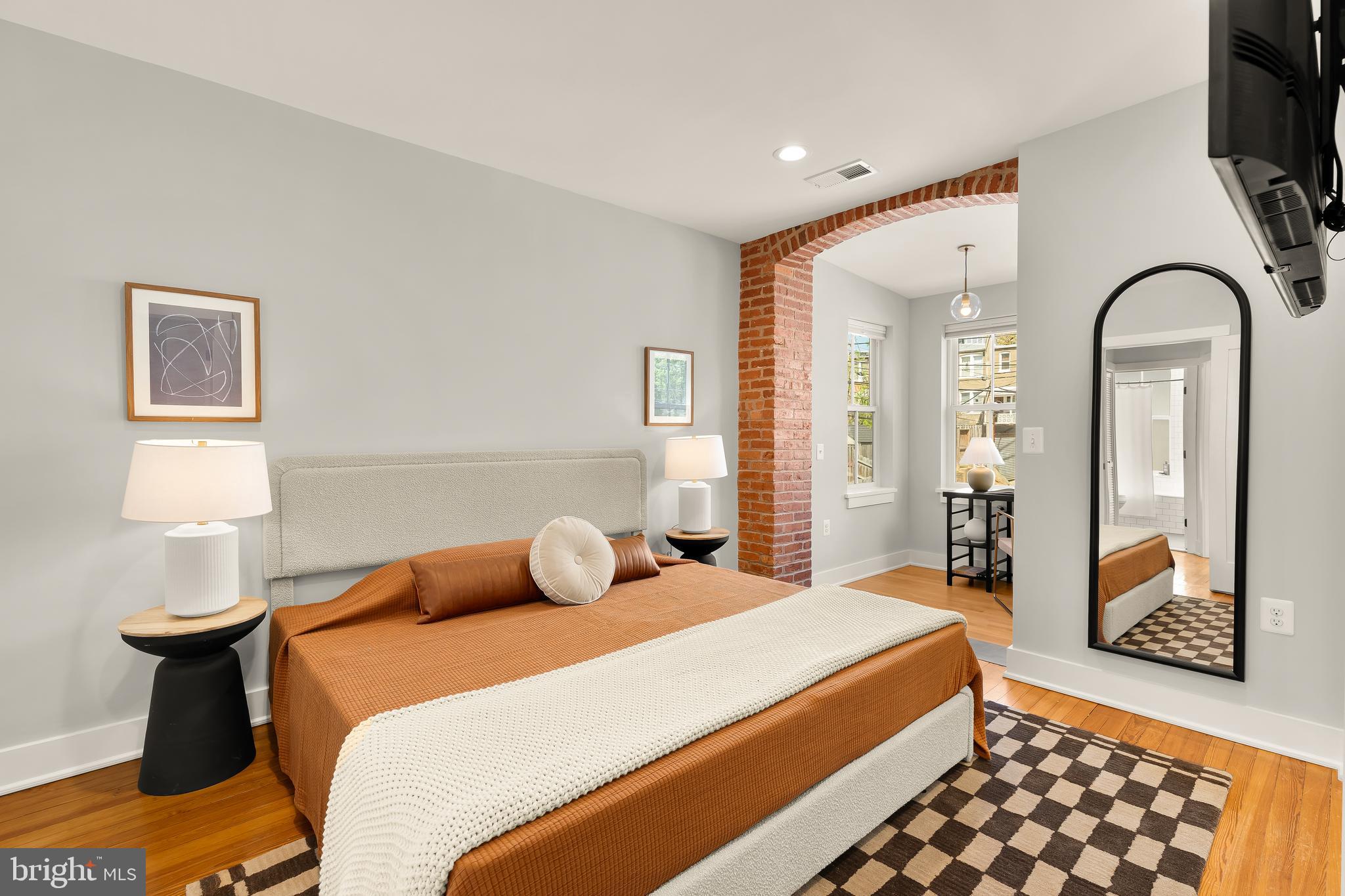 409 Columbia Road Northwest Washington, DC 20001 - Photo 24 of 41 a bedroom with a bed and wooden floor