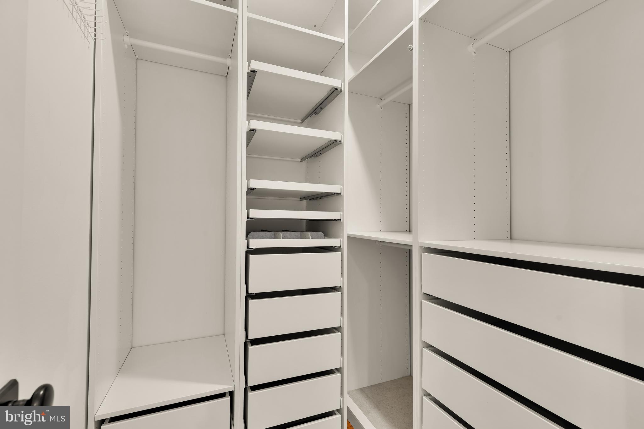 409 Columbia Road Northwest Washington, DC 20001 - Photo 28 of 41 a view of walk in closet with empty racks