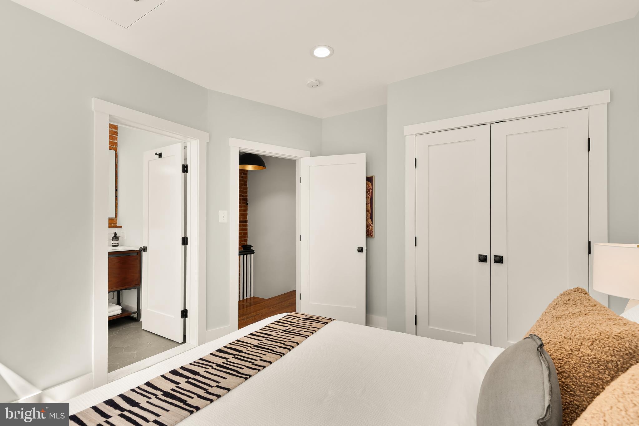 409 Columbia Road Northwest Washington, DC 20001 - Photo 32 of 41 a bedroom with a bed and a dresser