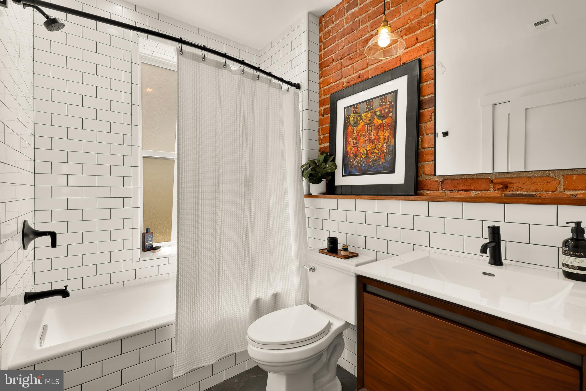 409 Columbia Road Northwest Washington, DC 20001 - Photo 34 of 41 a bathroom with a sink toilet and shower