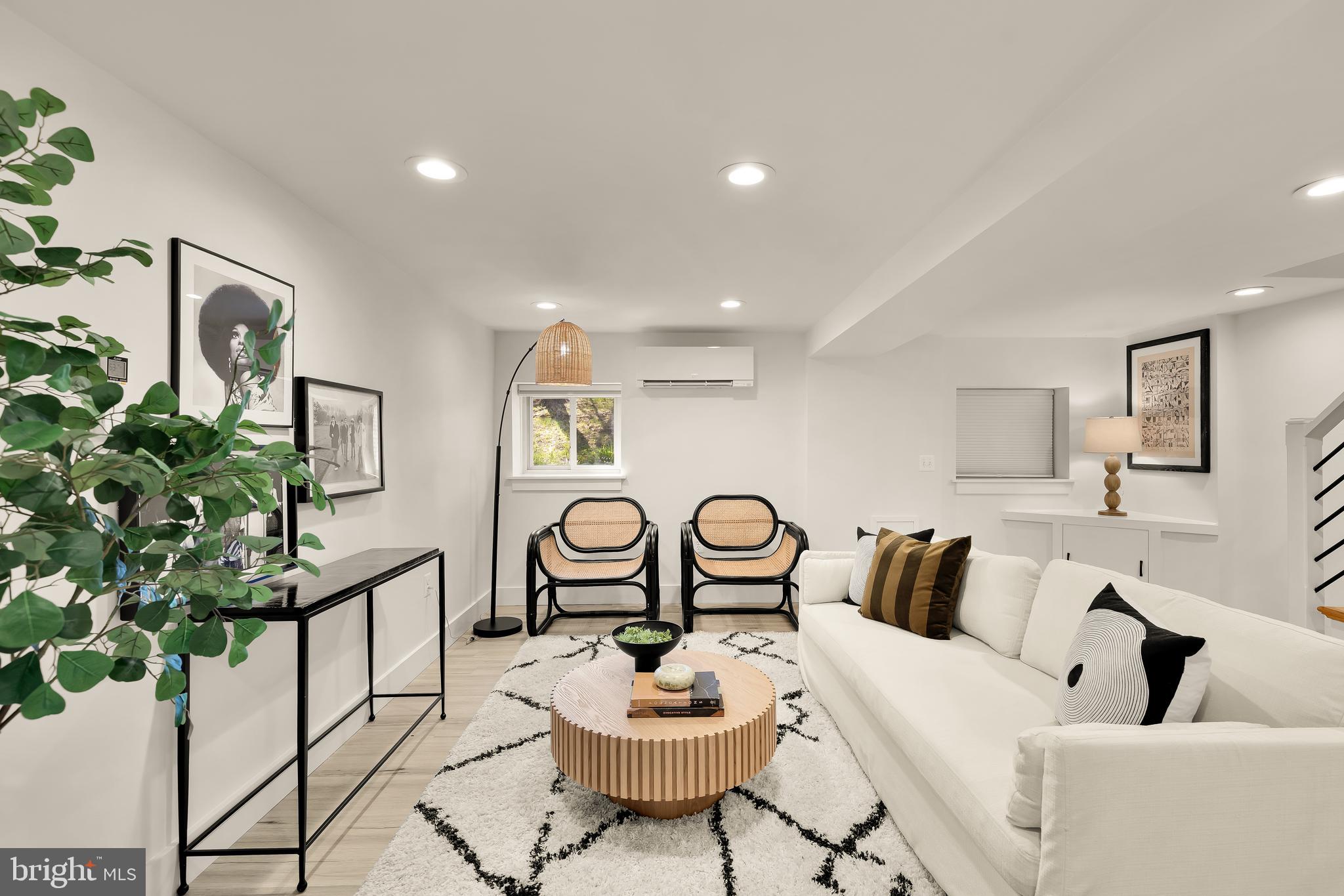 409 Columbia Road Northwest Washington, DC 20001 - Photo 36 of 41 a living room with furniture potted plant and a window
