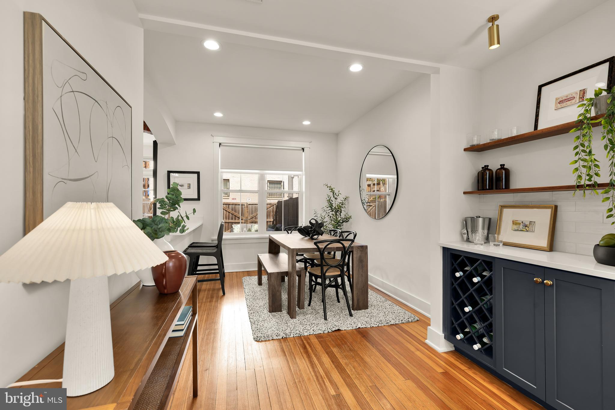 409 Columbia Road Northwest Washington, DC 20001 - Photo 7 of 41 a view of a dining room with furniture and wooden floor