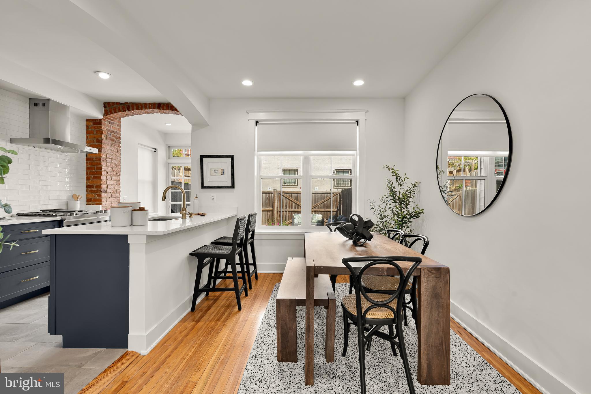 409 Columbia Road Northwest Washington, DC 20001 - Photo 9 of 41 a view of a dining room with furniture and a chandelier