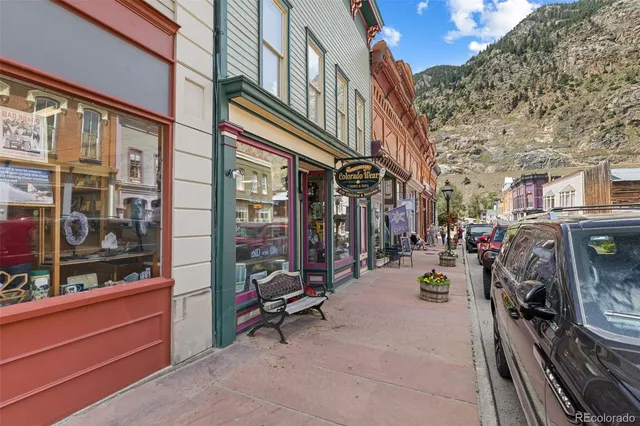 a view of path along with retail shop and buildings