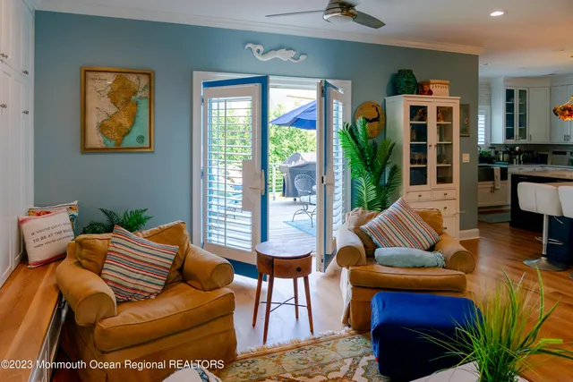 a living room with furniture fireplace and a window