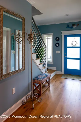 a view of an entryway with wooden floor