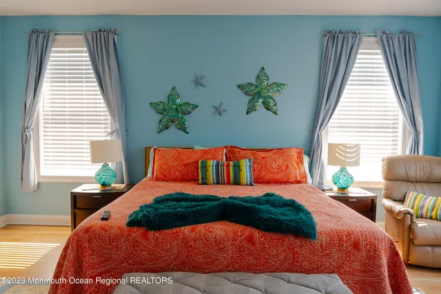 a bedroom with a large bed and a window