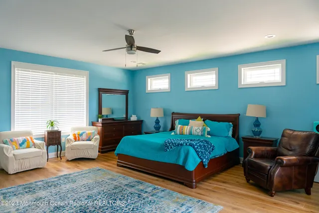 a bedroom with furniture and a window