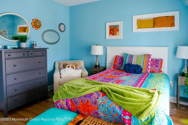 a bedroom with a bed and a dresser