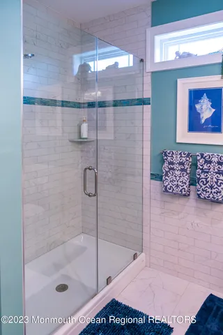 a bathroom with a shower and a bathtub