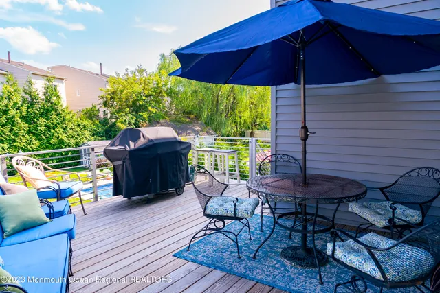 a view of a deck with furniture