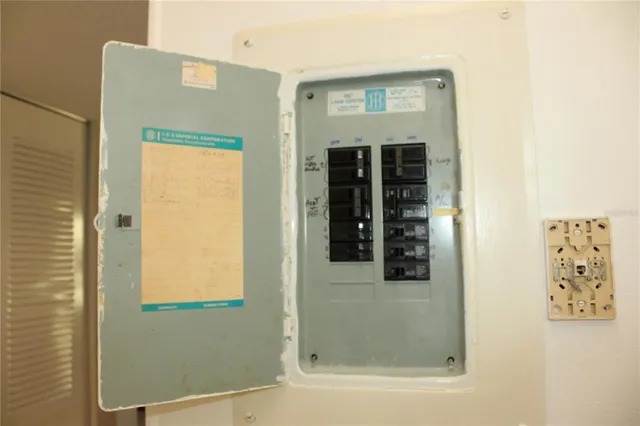 a view of a chairs and table in the back yard of the house