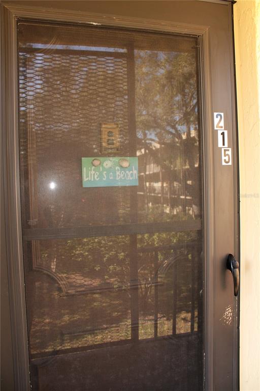 11485 Oakhurst Road, Unit 1200215 Largo, FL 33774 - Photo 3 of 68 a bathroom with a glass shower door