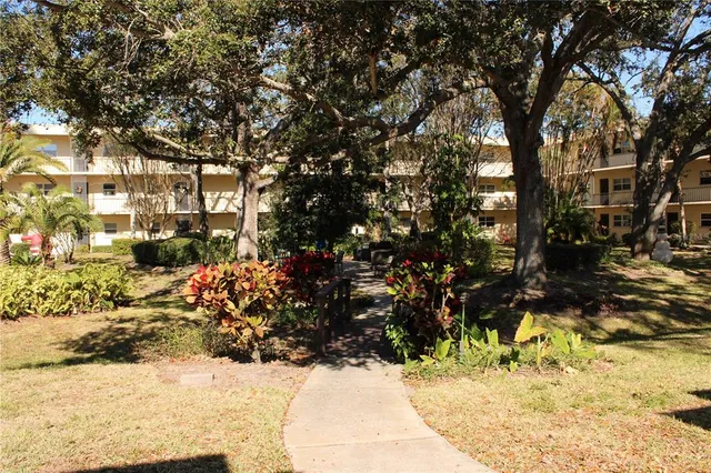 a front view of a building with tree s