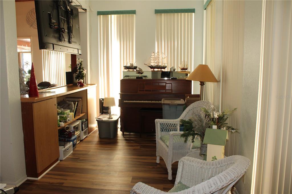 11485 Oakhurst Road, Unit 1200215 Largo, FL 33774 - Photo 46 of 68 a living room with furniture and a fireplace