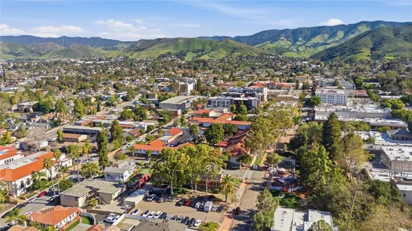 an aerial view of residential house with outdoor space and mountain view