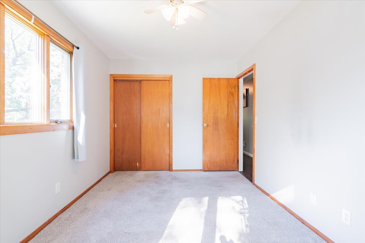 310 Rowe Drive Bloomington, IL 61701 - Photo 19 of 39 a view of an empty room with a window
