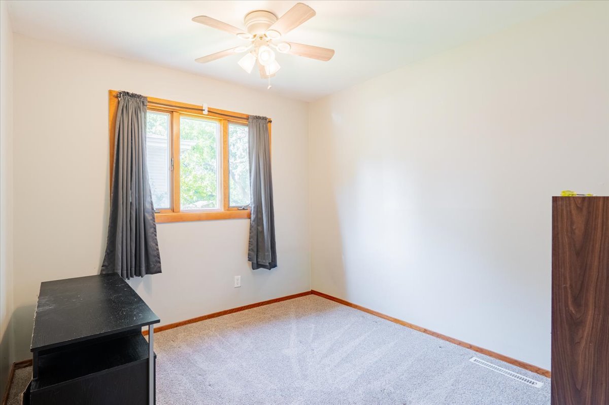 310 Rowe Drive Bloomington, IL 61701 - Photo 20 of 39 a view of an empty room with a window