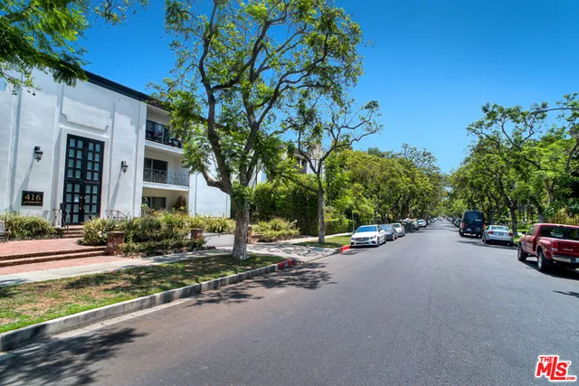 a view of a street with cars on road
