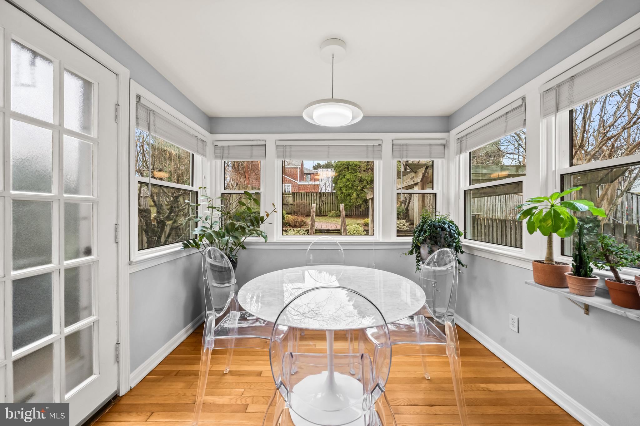 4228 40th Street Northwest Washington, DC 20016 - Photo 17 of 57 a living room with a large window and table