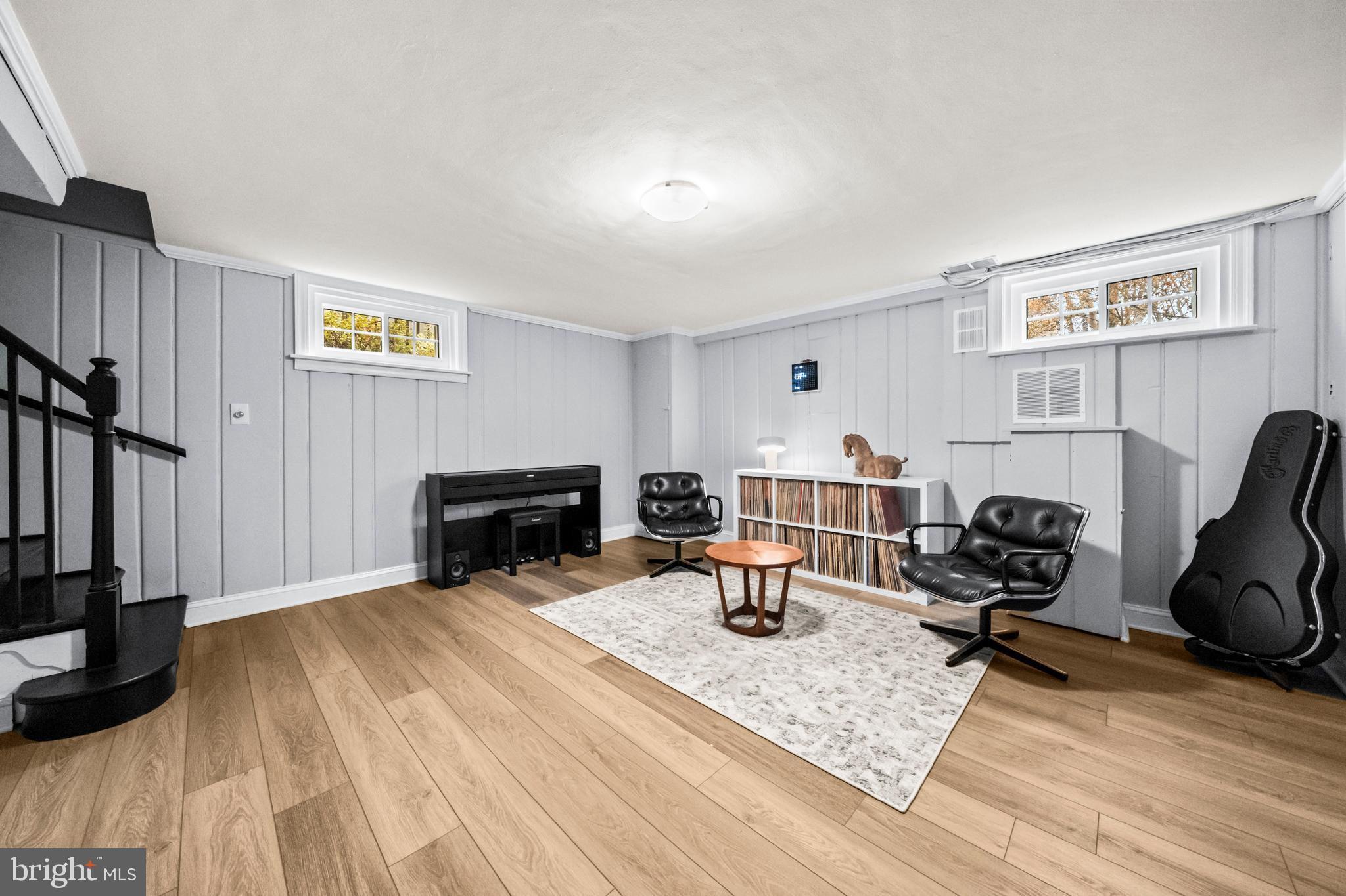 4228 40th Street Northwest Washington, DC 20016 - Photo 27 of 57 a living room with furniture a flat screen tv and a fireplace