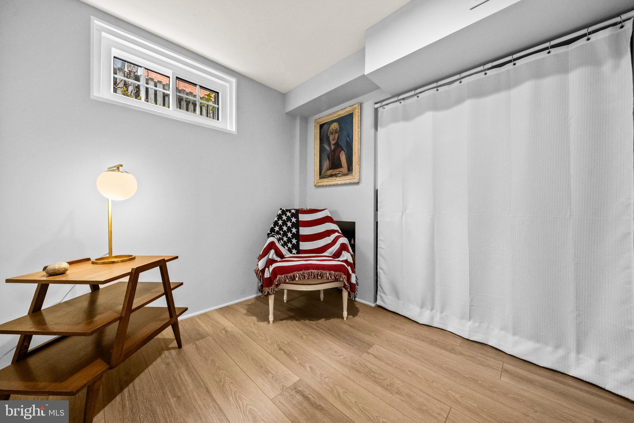 4228 40th Street Northwest Washington, DC 20016 - Photo 31 of 57 a bedroom with furniture and a lamp