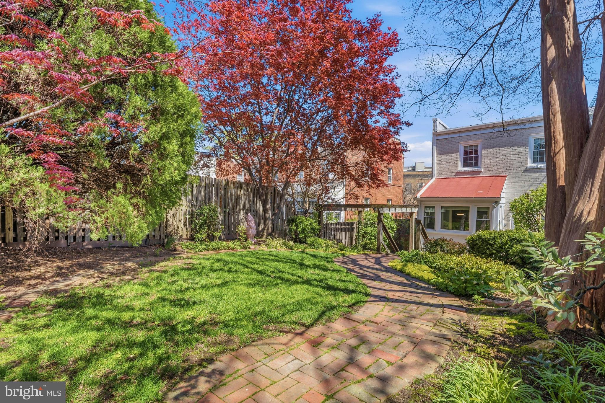 4228 40th Street Northwest Washington, DC 20016 - Photo 42 of 57 a front view of a house with a yard