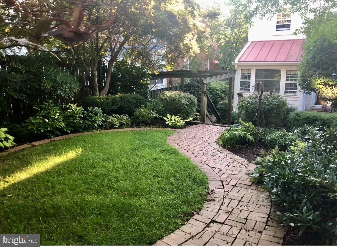 4228 40th Street Northwest Washington, DC 20016 - Photo 43 of 57 a front view of a house with a yard